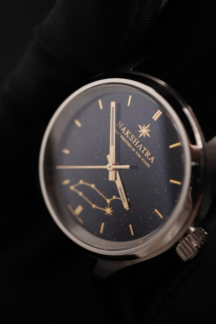 Essential Edition watch with a silver-tone case, star-speckled blue dial and gold-tone constellation details
